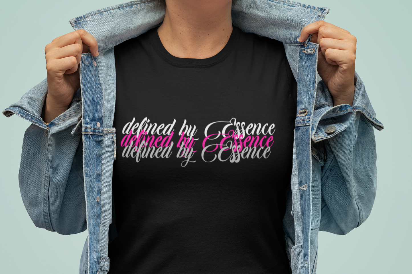 Women wearing black 3d Defined By Essence T- Shirt with multilayering wording with her collared popped.