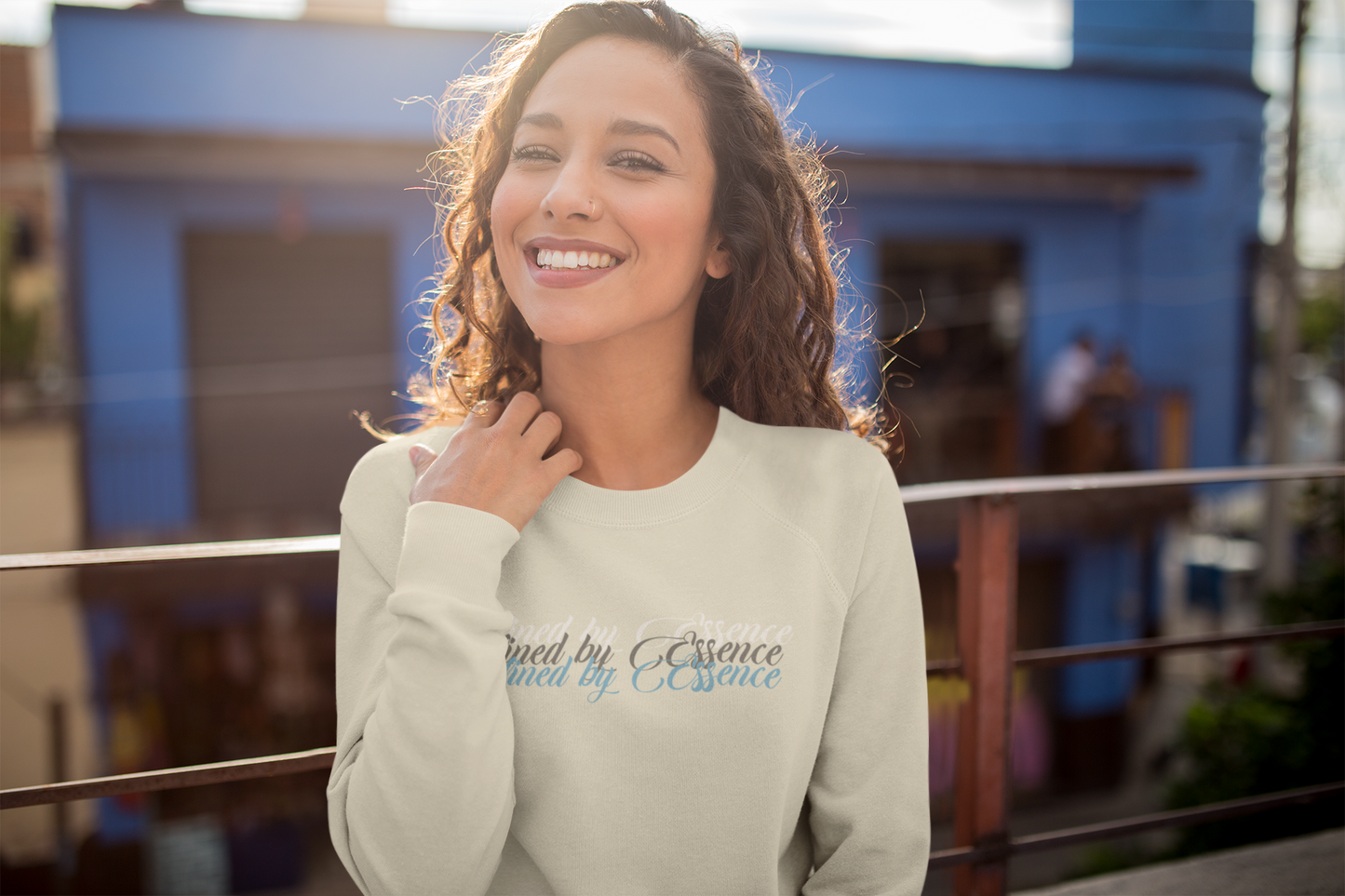 Women wearing a sand Defined By Essence sweatshirt, while hanging outside